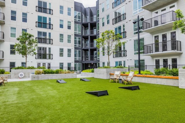 High Street Apartments offers residents plenty of options for enjoying the outdoors in comfort, from the outdoor patio space with soft seating to the private green space with ample seating.